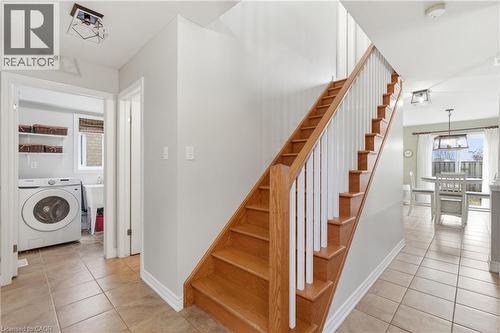 Hardwood staircase with white risers and railings - 84 Duncairn Crescent, Hamilton, ON - Indoor