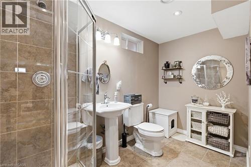 Bathroom featuring a glass-enclosed shower with tile surround, pedestal sink, and recessed lighting - 84 Duncairn Crescent, Hamilton, ON - Indoor Photo Showing Bathroom