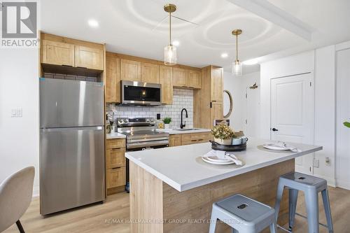 101 - 1950 Kennedy Road, Toronto, ON - Indoor Photo Showing Kitchen
