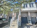 Brick facade townhome with covered porch entry, white railing, and multi-pane windows - 110 Highland Road E Unit# 53, Kitchener, ON  - Outdoor 