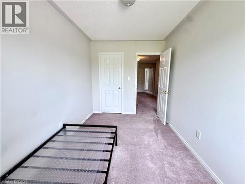 Bedroom featuring light-toned walls, plush purple carpeting, and white baseboards - 110 Highland Road E Unit# 53, Kitchener, ON - Indoor Photo Showing Other Room