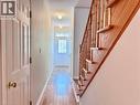 Entryway featuring a wood-finish staircase, paneled interior doors, and a front door with glass inserts - 110 Highland Road E Unit# 53, Kitchener, ON  - Indoor Photo Showing Other Room 