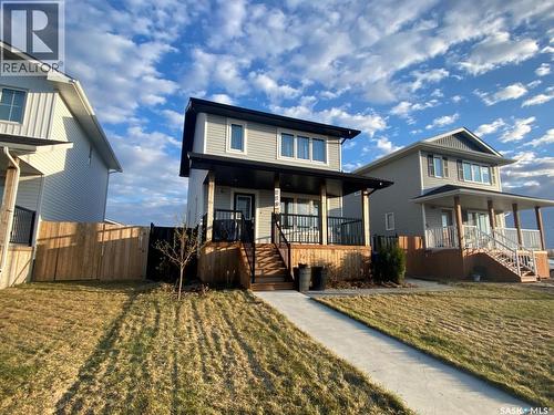 119 Reddekopp Crescent, Warman, SK - Outdoor With Deck Patio Veranda With Facade