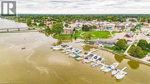 Waterfront properties featuring a marina with multiple boat slips, a public green space, and a community bridge - 32A Haldimand Trail, Dunnville, ON - Outdoor With Body Of Water With View