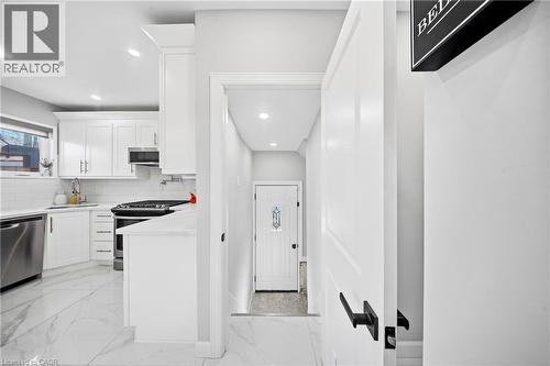 Kitchen featuring light marble finish flooring, white cabinets, stainless steel appliances, and recessed lighting - 273 Stinson Crescent, Hamilton, ON - Indoor Photo Showing Kitchen