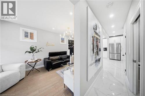 Hall with baseboards and a chandelier - 273 Stinson Crescent, Hamilton, ON - Indoor