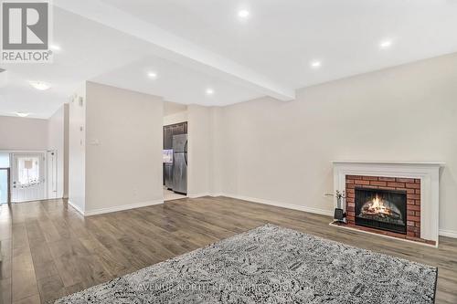 494 Sandhamn Private, Ottawa, ON - Indoor Photo Showing Living Room With Fireplace