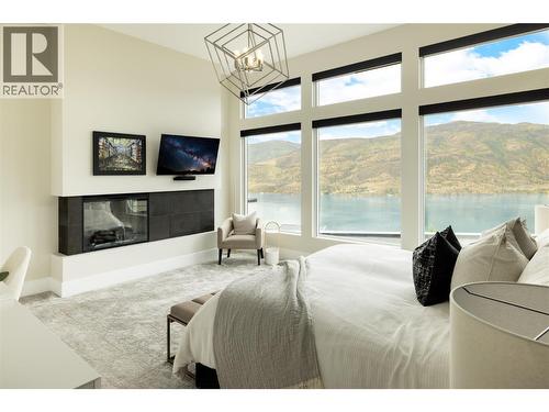 605 Clifton Court, Kelowna, BC - Indoor Photo Showing Bedroom With Fireplace