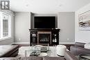 141 Oxbow Crescent, Regina, SK  - Indoor Photo Showing Living Room With Fireplace 
