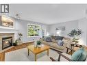 Welcome to #104 with its Bright and cozy main living area - 3825 Glen Canyon Drive Unit# 104, West Kelowna, BC  - Indoor Photo Showing Living Room With Fireplace 
