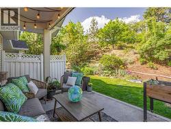Huge back patio area looking onto green space. - 
