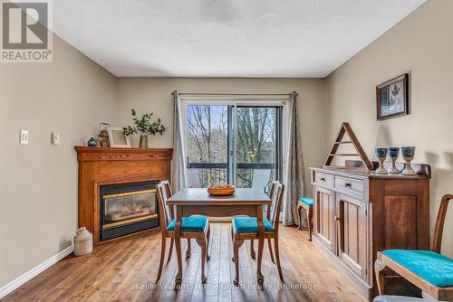 119 - 49 Rhonda Road, Guelph (Willow West/Sugarbush/West Acres), ON - Indoor Photo Showing Dining Room With Fireplace