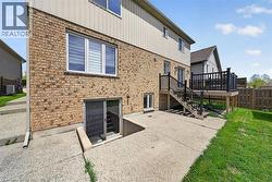 Exterior featuring brick veneer and light-colored siding - 