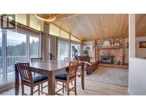 48 Stroulger Road, Enderby, BC - Indoor Photo Showing Dining Room With Fireplace