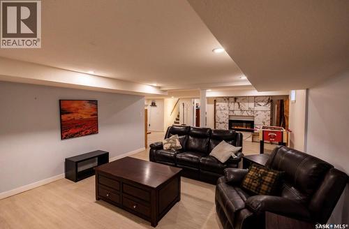 2258 Newis Bay E, Regina, SK - Indoor Photo Showing Living Room With Fireplace