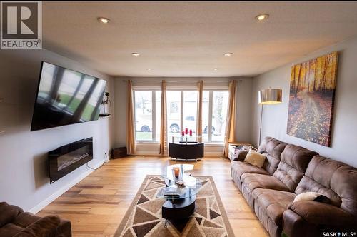 2258 Newis Bay E, Regina, SK - Indoor Photo Showing Living Room With Fireplace