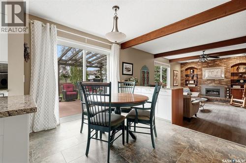 7 Cowie Road, Regina, SK - Indoor Photo Showing Dining Room With Fireplace