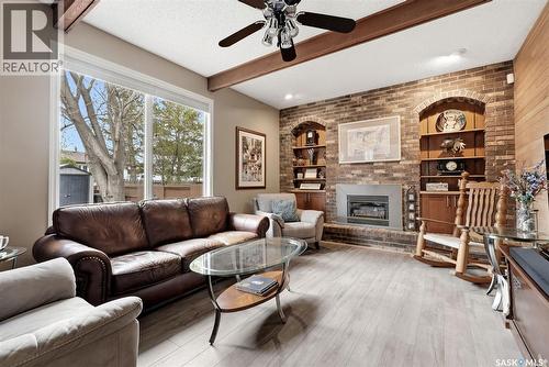 7 Cowie Road, Regina, SK - Indoor Photo Showing Living Room With Fireplace