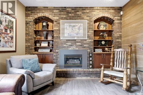 7 Cowie Road, Regina, SK - Indoor Photo Showing Living Room With Fireplace