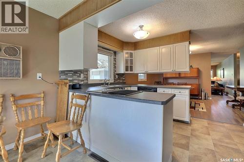 97 Compton Road, Regina, SK - Indoor Photo Showing Kitchen With Double Sink