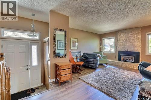 97 Compton Road, Regina, SK - Indoor Photo Showing Living Room With Fireplace