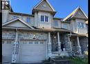Townhome exterior featuring stone veneer and light-toned siding - 517 Northbrook Place, Kitchener, ON  - Outdoor With Facade 