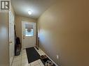 Entryway featuring neutral wall tones, white paneled doors, and a tiled floor - 517 Northbrook Place, Kitchener, ON  - Indoor Photo Showing Other Room 