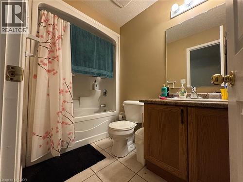 Bathroom with a white bathtub and shower combination unit, complete with chrome fixtures - 517 Northbrook Place, Kitchener, ON - Indoor Photo Showing Bathroom