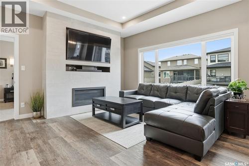 4264 Elderberry Crescent E, Regina, SK - Indoor Photo Showing Living Room With Fireplace