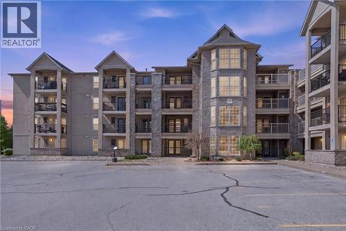 1451 Walkers Line Unit# 216, Burlington, ON - Outdoor With Balcony With Facade