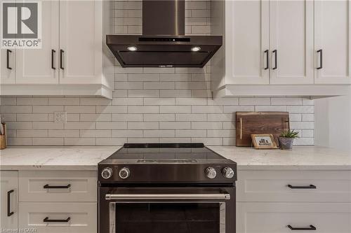 Upgraded range hood. - 81 Beasley Grove, Ancaster, ON - Indoor Photo Showing Kitchen