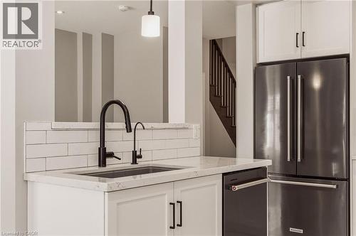 Cut-out facing the living room. - 81 Beasley Grove, Ancaster, ON - Indoor Photo Showing Kitchen With Upgraded Kitchen