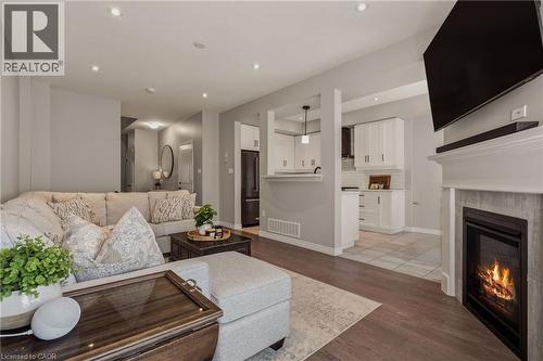 Upgraded built in gas fireplace. - 81 Beasley Grove, Ancaster, ON - Indoor Photo Showing Living Room With Fireplace