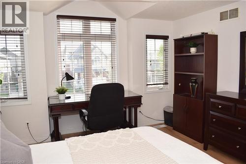 Bright bedroom with multiple windows featuring horizontal blinds - 28 Lemon Grass Street, Kitchener, ON - Indoor
