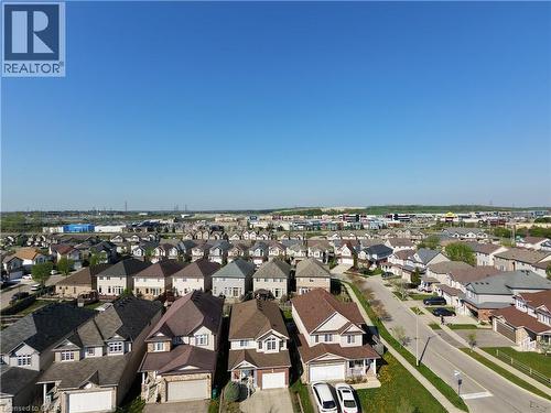 Residential neighborhood featuring numerous detached homes with varied architectural styles and rooflines - 28 Lemon Grass Street, Kitchener, ON - Outdoor With View