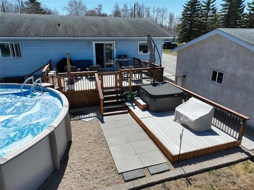 88 Second Avenue Sw, Teulon, MB - Outdoor With Above Ground Pool With Deck Patio Veranda With Exterior