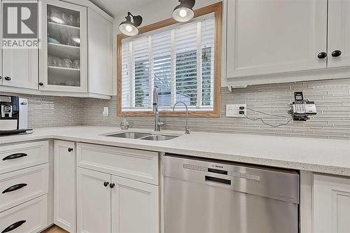 42 Sundown Close Se, Calgary, AB - Indoor Photo Showing Kitchen With Double Sink With Upgraded Kitchen
