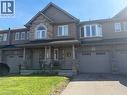 Stone and brick facade featuring a covered front porch with stone pillars - 25 Bethune Avenue, Hamilton, ON  - Outdoor With Facade 