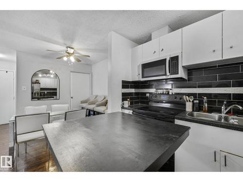 #A7 2808 116 St Nw, Edmonton, AB - Indoor Photo Showing Kitchen With Double Sink