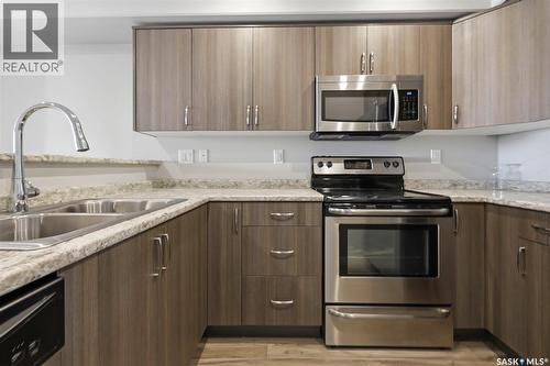 209 915 Kristjanson Road, Saskatoon, SK - Indoor Photo Showing Kitchen With Double Sink