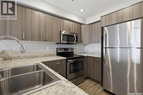 209 915 Kristjanson Road, Saskatoon, SK - Indoor Photo Showing Kitchen With Double Sink