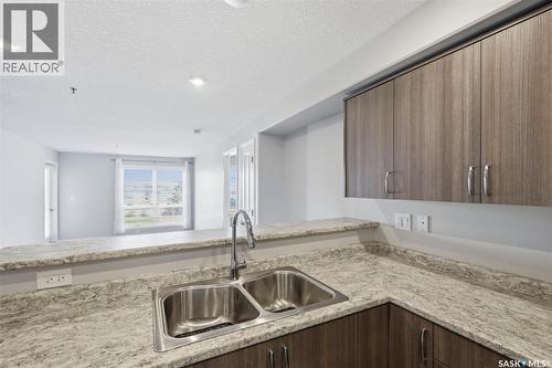 209 915 Kristjanson Road, Saskatoon, SK - Indoor Photo Showing Kitchen With Double Sink