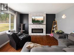 Living room with recently built feature wall and electric fireplace. - 