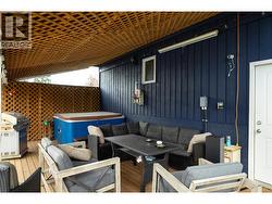 Covered rear deck with hot tub - 