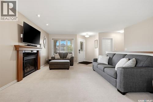 2090 Laurier Bay E, Regina, SK - Indoor Photo Showing Living Room With Fireplace