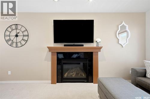 2090 Laurier Bay E, Regina, SK - Indoor Photo Showing Living Room With Fireplace