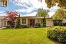 Brick exterior with a single-car garage and a paved driveway - 643 Artreva Crescent, Burlington, ON  - Outdoor 