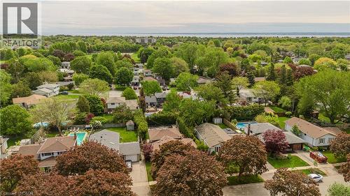 Aerial perspective showcasing a residential area with mature trees and a distant body of water - 643 Artreva Crescent, Burlington, ON - Outdoor With View