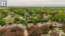 Aerial perspective showcasing a residential area with mature trees and a distant body of water - 643 Artreva Crescent, Burlington, ON  - Outdoor With View 