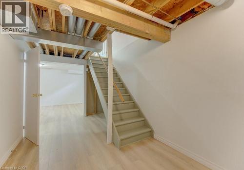 Unfinished basement space featuring exposed wooden joists and ductwork - 603 Pinerow Crescent Unit# B, Waterloo, ON 